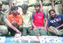Five persons arrested by the Delhi Police for their alleged involvement in the Dariba Kalan burglary in New Delhi on Thursday. 