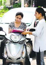 A student busy in a signature campaign against the land revocation order on the University of Jammu campus on Thursday.