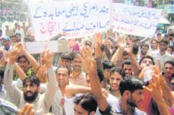 CPM activists take part in a protest demonstration against Indo-US nuclear deal at Lal Chowk in Srinagar on Thursday