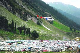 A private helicopter is seen over a base camp lodging Amarnath pilgrims from Baltal to Amarnath cave, about 110 km south-east of Srinagar.