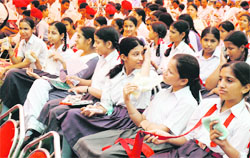 Students beat the heat during a function of the Chief Minister in Ludhiana