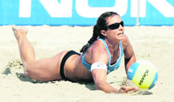 USAs Misty May-Treanor dives for the ball during their final match against Brazil at the FIVB Beach volleyball Grand Slam tournament in Klagenfurt in this August 4, 2007 file photo.