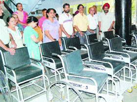 Medical college students donate wheelchairs and a water cooler to Guru Nanak Dev Hospital in Amritsar on Friday.
