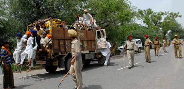 Police personnel keep vigil on Punjabs border with Haryana near Dabwali on Friday. Strict security arrangements had been made to prevent the occurrence of any untoward incident. 