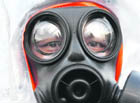 A police officer in a protective suit takes part in a chemical, biological, radiological and nuclear field exercise near the Olympic equestrian venue in Hong Kong on Friday. Hong Kong police said the territory will deploy up to 4,000 police officers during the Olympic equestrian events to be held in August.