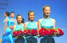 Models display the costumes for hostesses during a ceremony to unveil the Beijing Olympics Award Ceremony Etiquette Apparel and Accessories in Beijing on Thursday, China Daily reported. Hostesses will carry the medals and wreaths during the medal ceremony for each sporting event. 