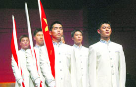 Models display the costumes for flag raisers during a ceremony to unveil Beijing Olympics Award Ceremony Etiquette Apparel and Accessories in Beijing on Thursday. Organisers of the Beijing Olympics unveiled the podium and costumes for the medal ceremony on Thursday, China Daily reported. 