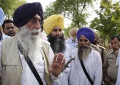 SAD (A) chief Simranjeet Singh Mann speaks to mediapersons while returning after attending the cremation of Harminder Singh, who died in Dera-Sikh clash, at Doomwali barrier on Saturday.