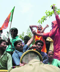 BJP activists protest against the Delhi police on the law and order situation at the PHQ in New Delhi on Saturday.