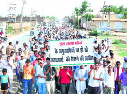 Followers of Dera Sacha Sauda hold a protest in Sirsa on Saturday.