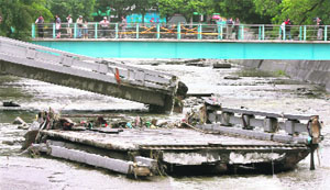 The debris of a bridge damaged by Typhoon Kalmaegi in Taichung, northeast Taiwan, on Saturday. Eighteen persons were killed and seven went missing in the typhoon that hit the area on Friday.