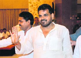 Rebel BJP MP from Balrampur, UP, Brij Bhushan Sharan gestures as he arrives to attend a dinner hosted by the Prime Minister in New Delhi