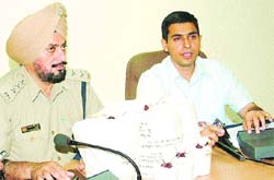 SP (HQ) Satinder Singh (R) addresses mediapersons in Jalandhar on Sunday.
