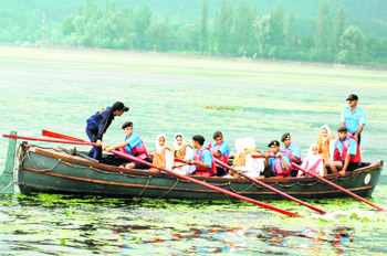 Cadets of the J&K Naval unit of the NCC undergo training at the Dal Lake in Srinagar on Sunday. 