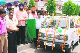 Mayor Hakim Singh Giaspura flags off an Ace Road Assist vehicle in Ludhiana on Saturday.