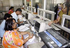 An official at the civil hospital issues manual slips as computers do not work