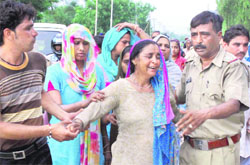 Cops console the grieving family of the victim in sector 25, Chandigarh,