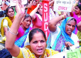 Activists of the SUCI shout slogans during their demonstration against the Indo-US nuclear deal near the Parliament House in New Delhi