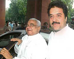 Former Haryana Chief Minister Bhajan Lal and his son Kuldeep Bishnoi arrive at Parliament for the two-day special session on Monday.