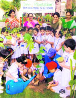 Students of BCM Arya Model Senior Secondary School during a tree plantation drive in Ludhiana on Monday.