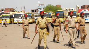 Policemen patrolling the Bathinda bus stand on Wednesday. 