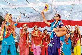 Schoolgirls perform giddha during the inauguration of sports meet at S.S. School, Kolan village, in Ambala