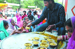 Langar is distributed on gurpurb at Rakab Ganj Gurdwara in New Delhi