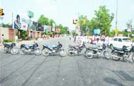Activists of the All-India Sikh Students Federation block traffic and brandish kirpans at PAP Chowk in Jalandhar on Wednesday.