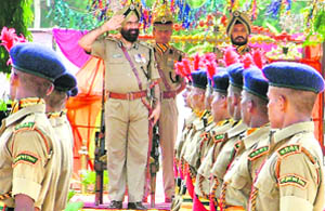 P.P. Singh, IG North West Zone, takes the salute from newly passed-out constables at the ITBP camp, Baddowal, on Wednesday. 