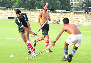 Aspirants during the trials conducted by the District Hockey Association, Ludhiana, at PAU grounds. 