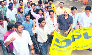 SOPU activists stage a protest against the denial of hostel accommodation to students at PU on Thursday.