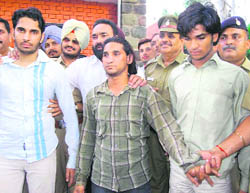 Vicky, Nadeem and Sanjay being taken to police station in Chandigarh on Thursday. 