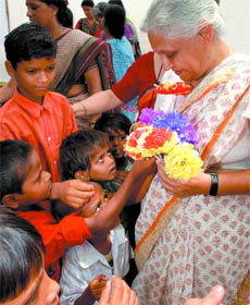 Chief Minister of Delhi Sheila Dikshit interacts with children after inaugurating a creche for construction workers' children at Jawaharlal Nehru Stadium.