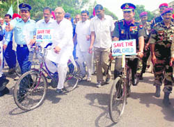The Chief of Army Staff, Gen Deepak Kapoor, and Chief Minister Bhupinder Singh Hooda participate in an awareness cycle rally organised by the NCC as part of the save-the-girl-child campaign at the NDRI complex in Karnal.