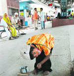 Six-year-old Sukan performs tricks to earn his livelihood at Karnal railway station. Sukan is among the 90 million children in the six to 14 age group who do not go to school and are engaged in some occupation or other. According to official figures, close to 50 per cent of children in India are deprived of their right to a free and happy childhood.