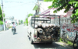 Oxygen gas cylinders being carried away from a godown in a house at Golden Avenue in Jalandhar