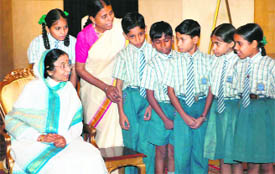 President Pratibha Patil interacts with underprivileged children before a group photo session at Rashtrapati Bhawan in New Delhi on Thursday. 