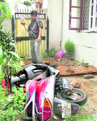 A BJP activist ransacks the residence of partys MP Chandrabhan Singh from Madhya Pradesh, in New Delhi on Thursday.