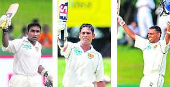 Sri Lanka's Mahela Jayawardene (L), Malinda Warnapura (C) and Thilan Samaraweera acknowledge the crowd after reaching their centuries against India during the second day of the first Test in Colombo on Thursday. 