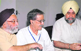 A Pakistani journalist with Punjab chief secretary Ramesh Inder Singh (right) and former Ambassador P.S. Sahai during an interaction of Indian experts with a Pakistani media delegation at the Centre for Research in Rural and Industrial Development in Chandigarh on Friday.