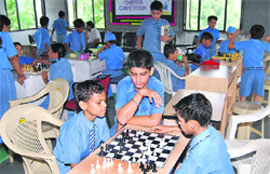 Students of Alpine Senior Secondary School participate in a chess competition on the school campus in Ludhiana