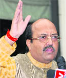 Samajwadi Party general secretary Amar Singh addresses at a press conference at his residence in New Delhi on Friday.