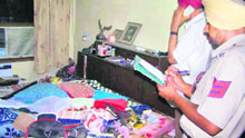 A cop takes down the details of a theft in Dera Bassi on Saturday.