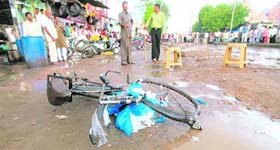 A cycle lies at the site of a blast at Naroda Bazar in Ahmedabad