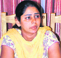 Depinder Kaur Hundal breaks down as she talks about her son Aviraj at a press conference in Panchkula.