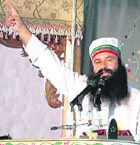 Dera Sacha Sauda chief Gurmeet Ram Rahim Singh addresses mediapersons at his headquarters in Sirsa on Sunday.