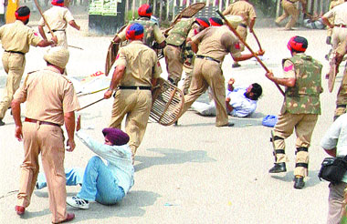 Policemen lathicharge agitating jobless BEd teachers in Kapurthala on Sunday.