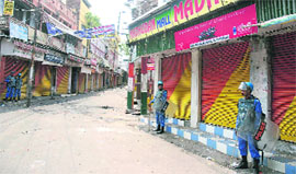 Rapid Action Force personnel deployed during the curfew in Jammu on Sunday. 