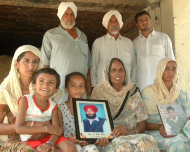 Family members of cousin farmers, who committed suicide allegedly for being unable to pay off their debts, at Kotshamire village in Bathinda.
