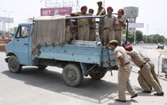 Bathinda policemen pushing their truck to reach some spot of action on Monday.